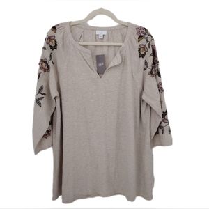 New v-neck Jersey blouse with floral arm.